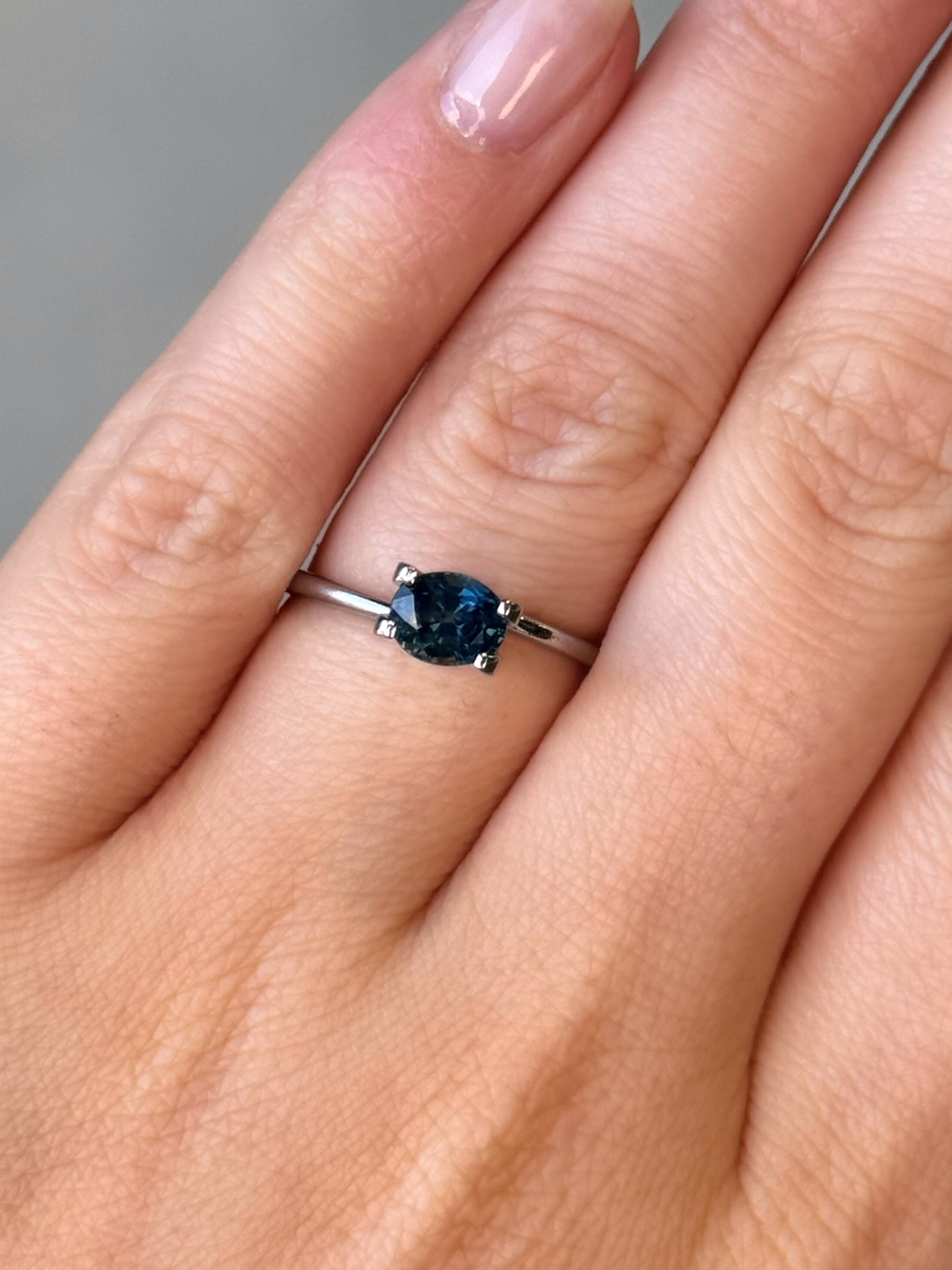 1.01ct oval cut dark blue sapphire Adelaide sapphire engagement ring