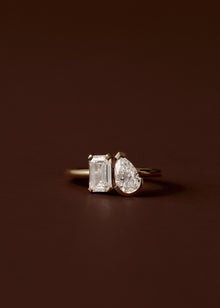 Pear and emerald cut diamond toi et moi engagement ring in yellow gold