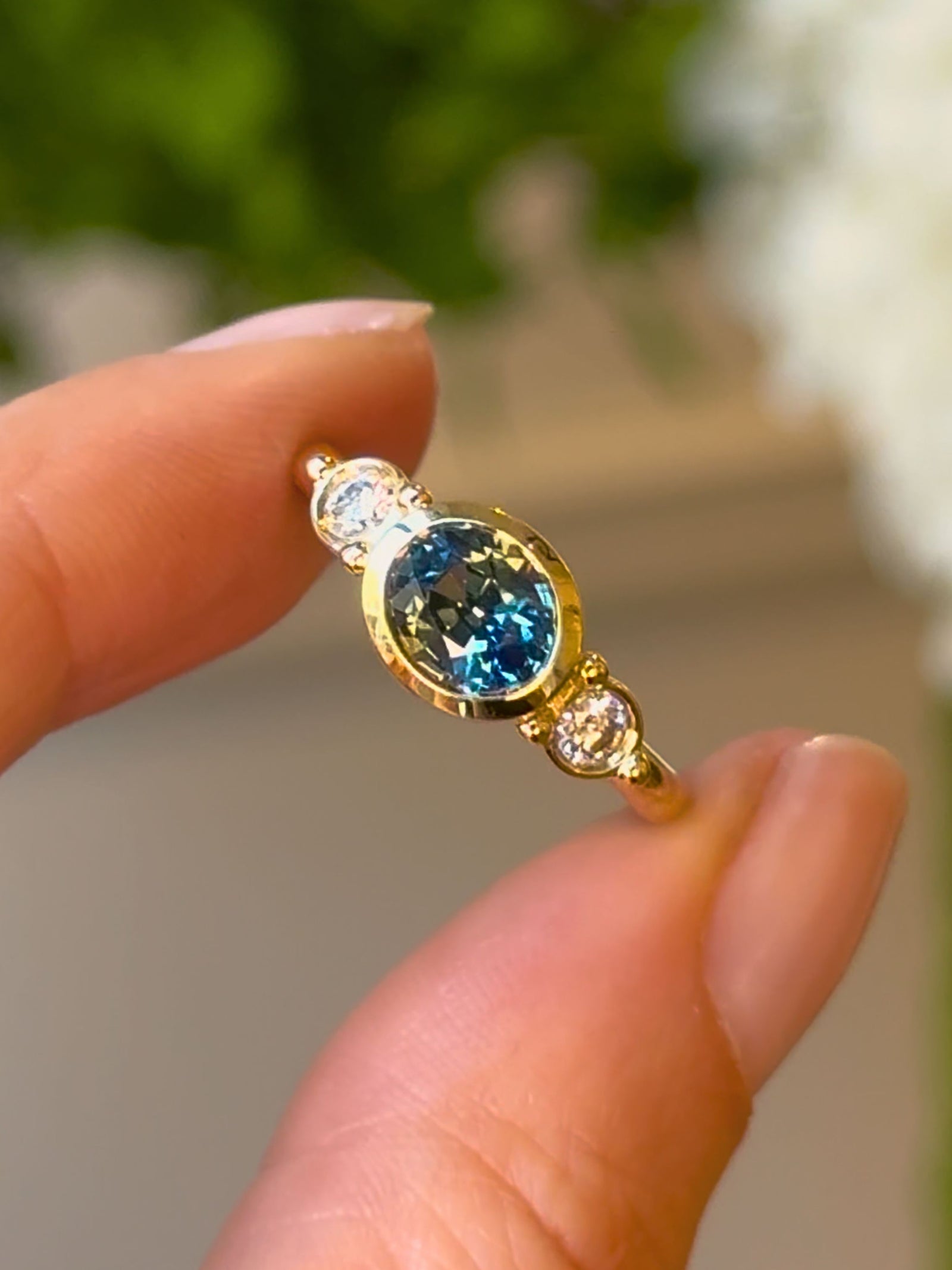 Olivia Trilogy Ring with a Teal Blue Sapphire
