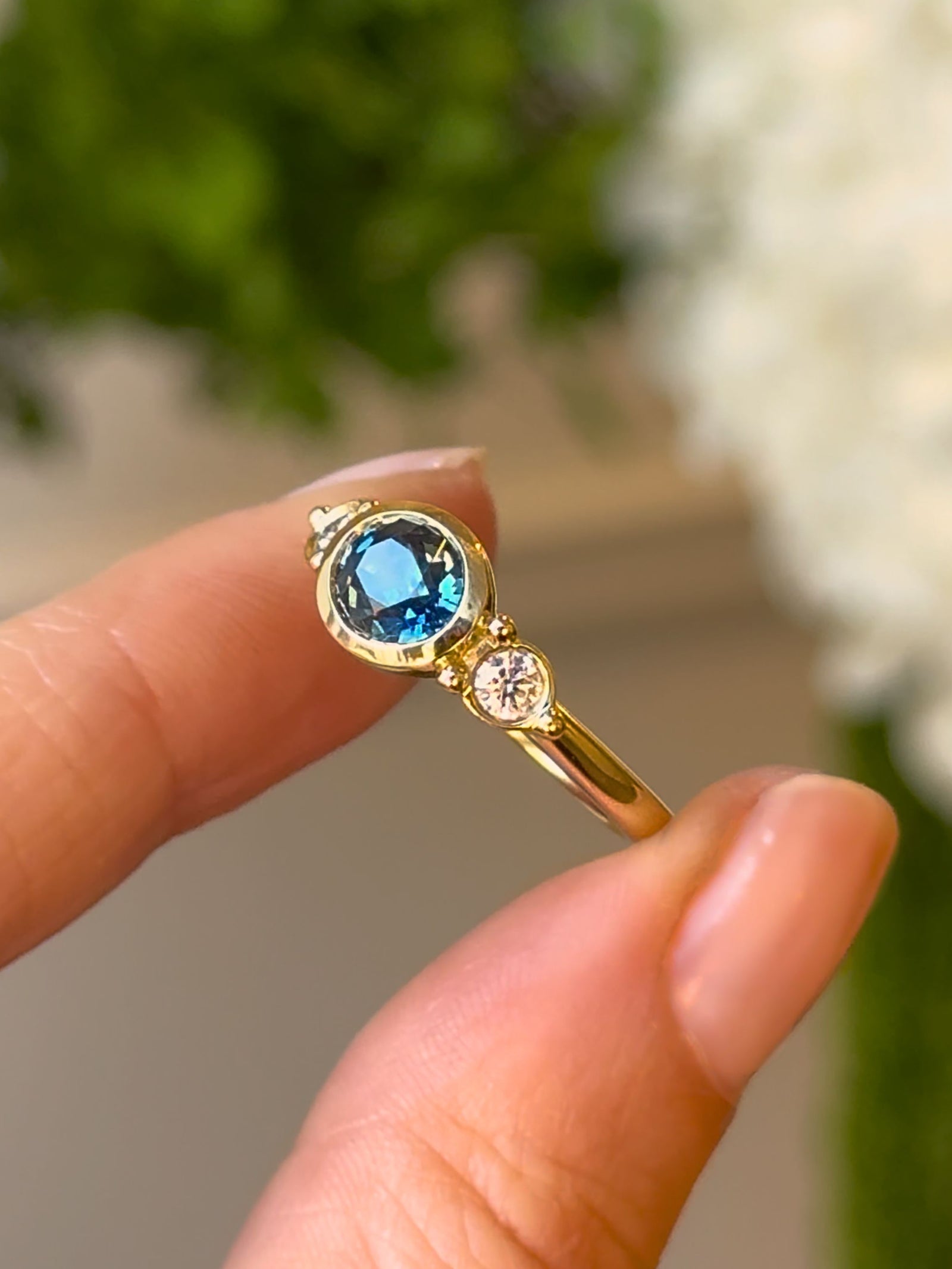 Olivia Trilogy Ring with a Teal Blue Sapphire