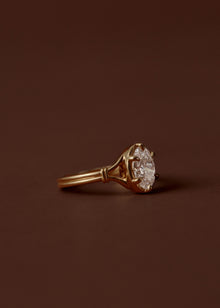 1.50ct Oval diamond split shank engagement ring with six talon claws and collet setting