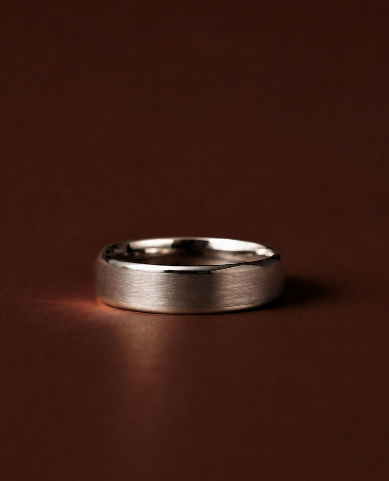 Curved bevelled edge wedding ring with brushed matte finish and polished edges
