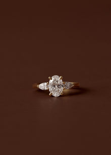1.50ct oval diamond engagement ring with pear cut diamond side stones