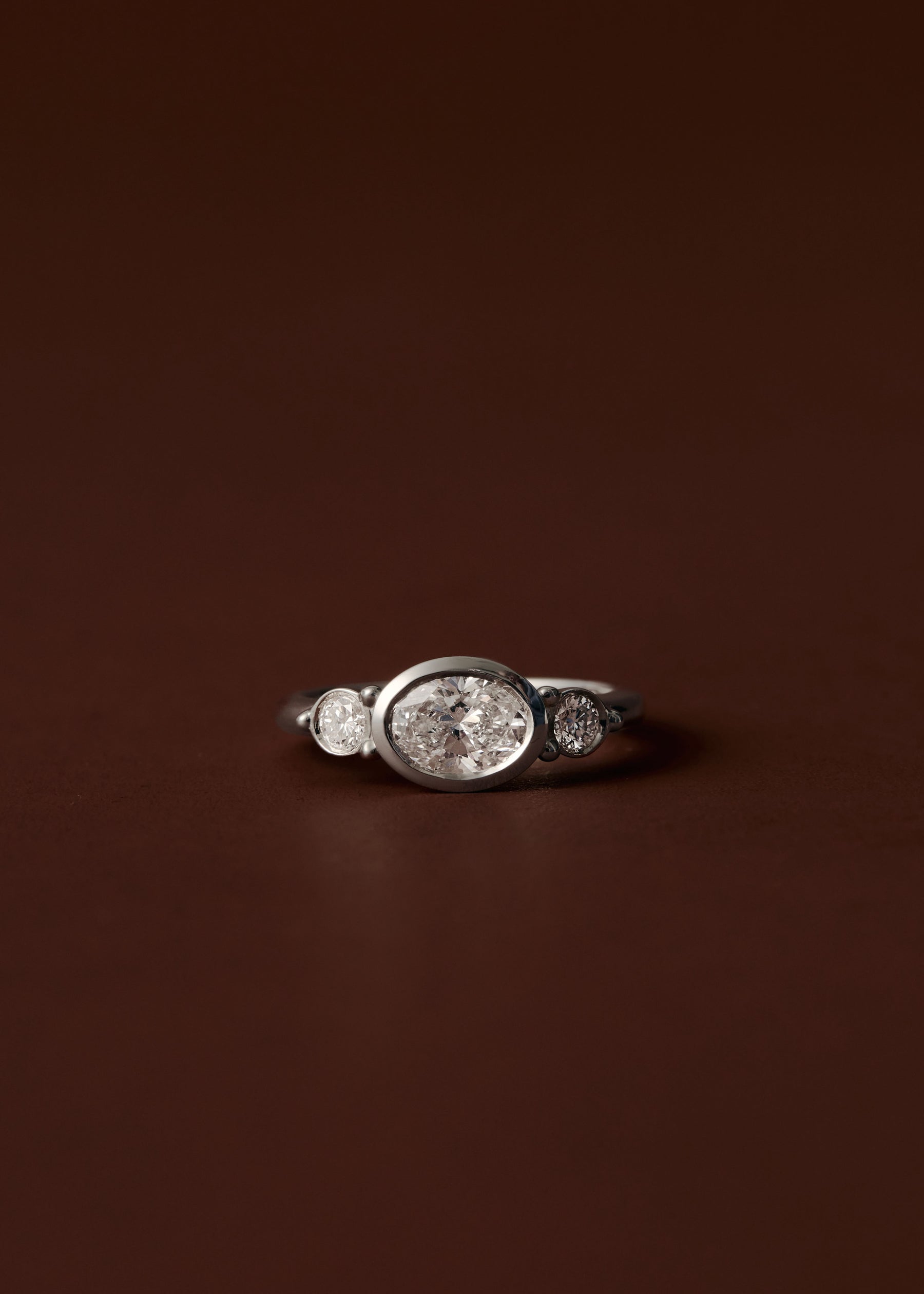 Olivia Three Stone Bezel Engagement Ring