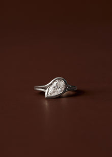 1.50ct Pear diamond engagement ring with sculpted semi bezel setting and double wire band