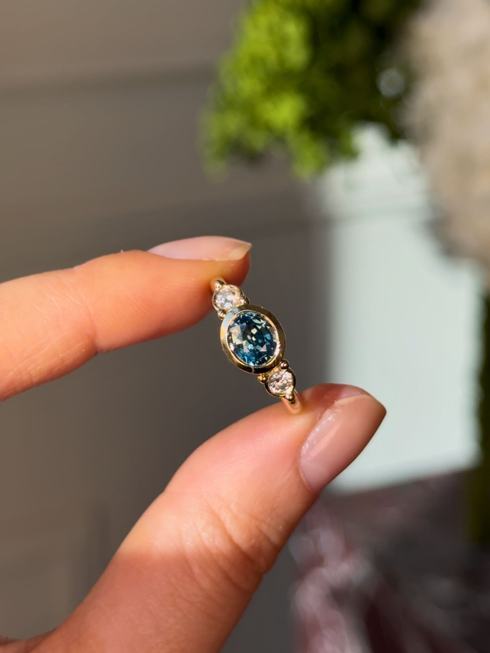 Olivia Trilogy Ring with a Teal Blue Sapphire