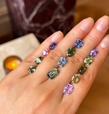 colourful sapphires on hand